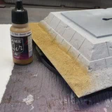 Airbrushen des Sandes und des Sandsteines.